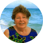 a woman smiling on the beach