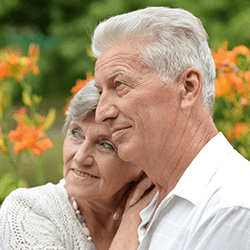 an older couple embracing